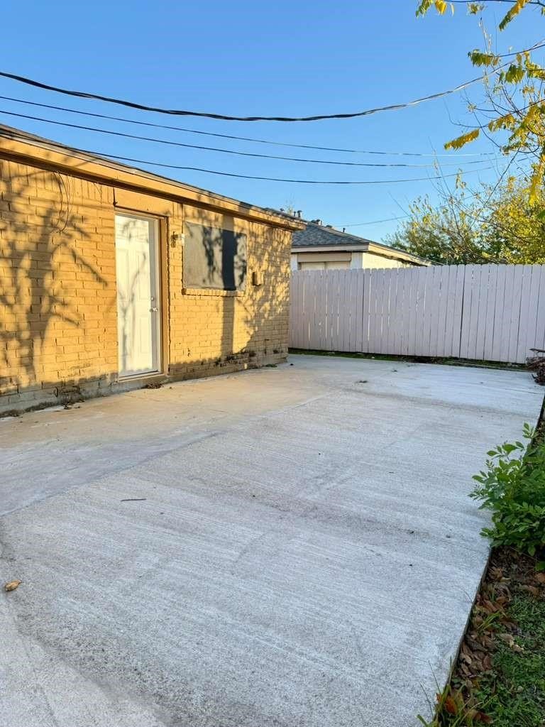 7318 Boone Road, Unit B Houston, TX 77072 - Photo 22 of 23 a view of an empty room with a window