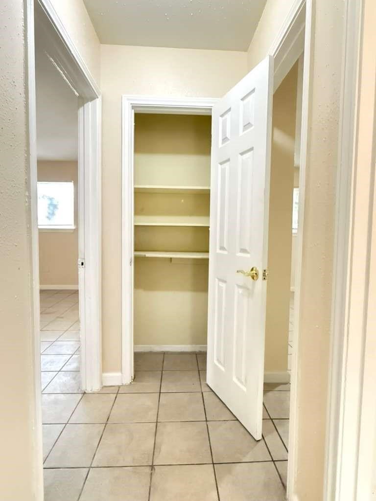 7318 Boone Road, Unit B Houston, TX 77072 - Photo 6 of 23 a view of a closet area with living room