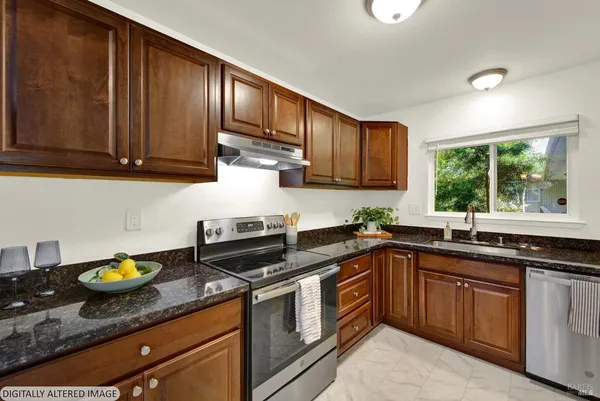 a kitchen with a sink stove top oven and cabinets