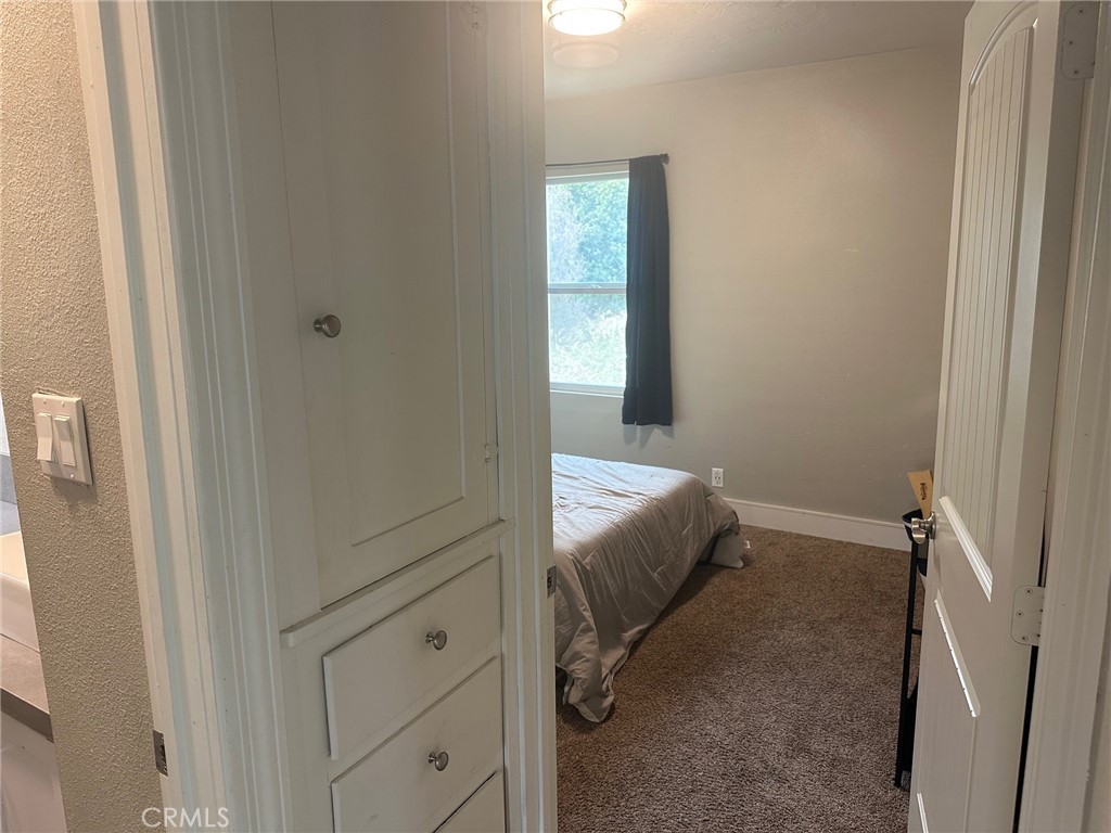 310 Santa Rita Place Banning, CA 92220 - Photo 12 of 27 a room with a bed and a window