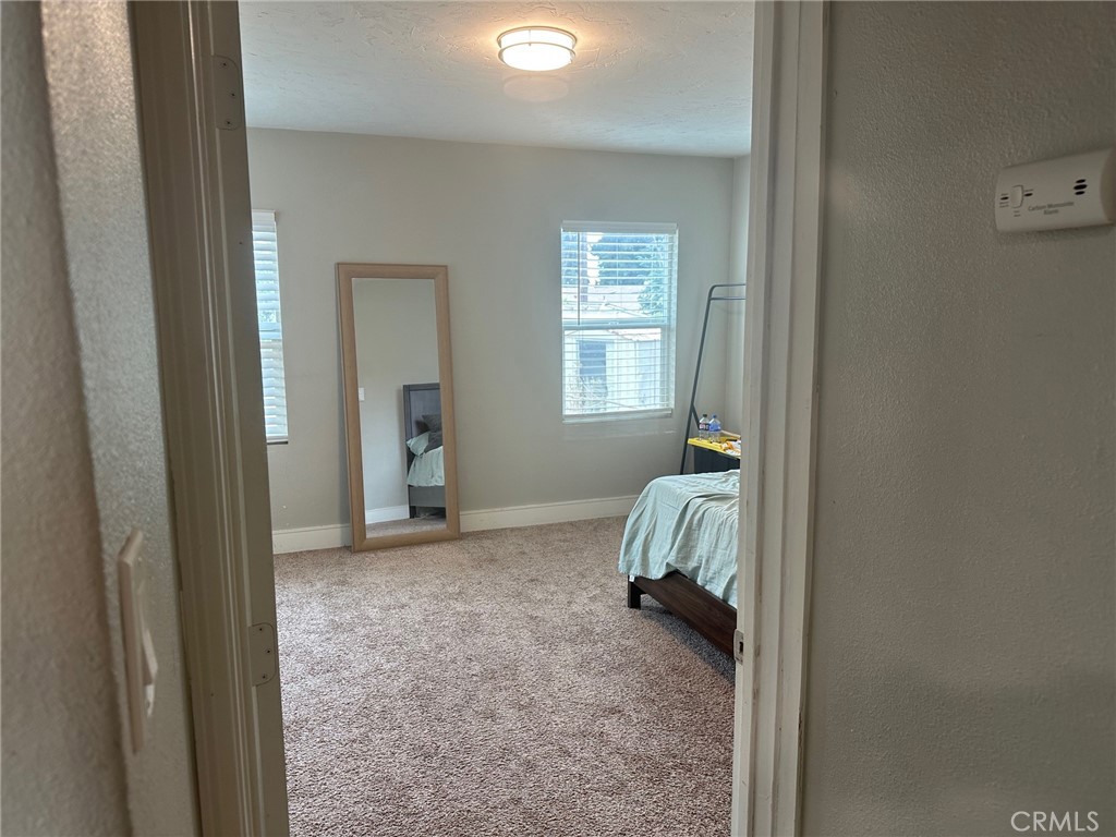 310 Santa Rita Place Banning, CA 92220 - Photo 13 of 27 a view of bedroom with window