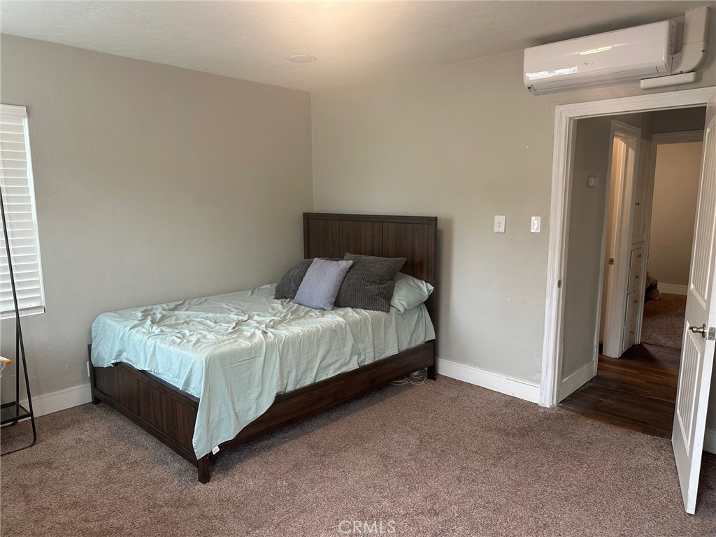 310 Santa Rita Place Banning, CA 92220 - Photo 16 of 27 a bed sitting in a bedroom next to a window