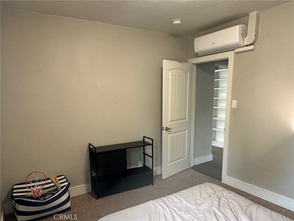 310 Santa Rita Place Banning, CA 92220 - Photo 20 of 27 a bedroom with a bed and a couch
