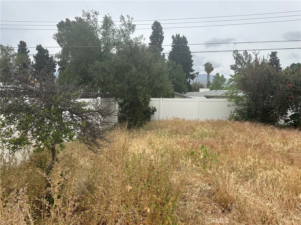 310 Santa Rita Place Banning, CA 92220 - Photo 24 of 27 a view of a yard in front of a house