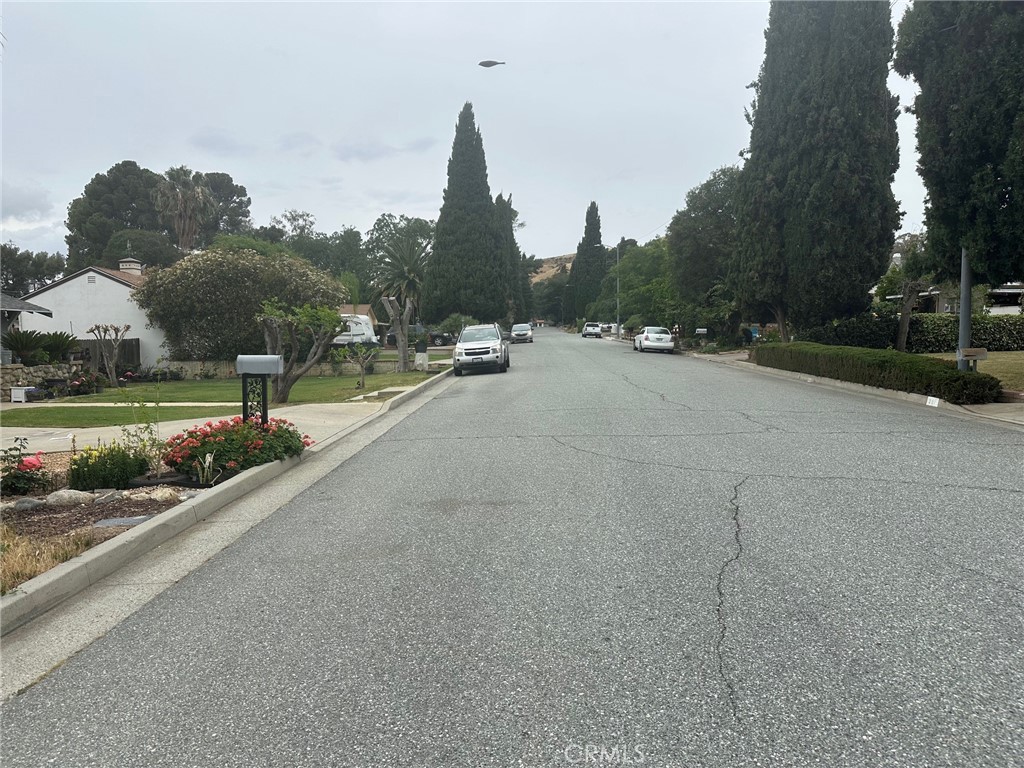 310 Santa Rita Place Banning, CA 92220 - Photo 4 of 27 a view of a street with a large trees