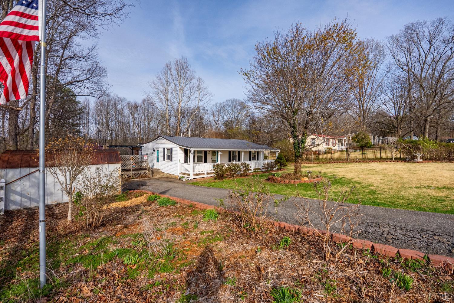 997 Toytown Road Amherst, VA 24521 - Photo 23 of 50 a front view of a house with a yard covered with trees
