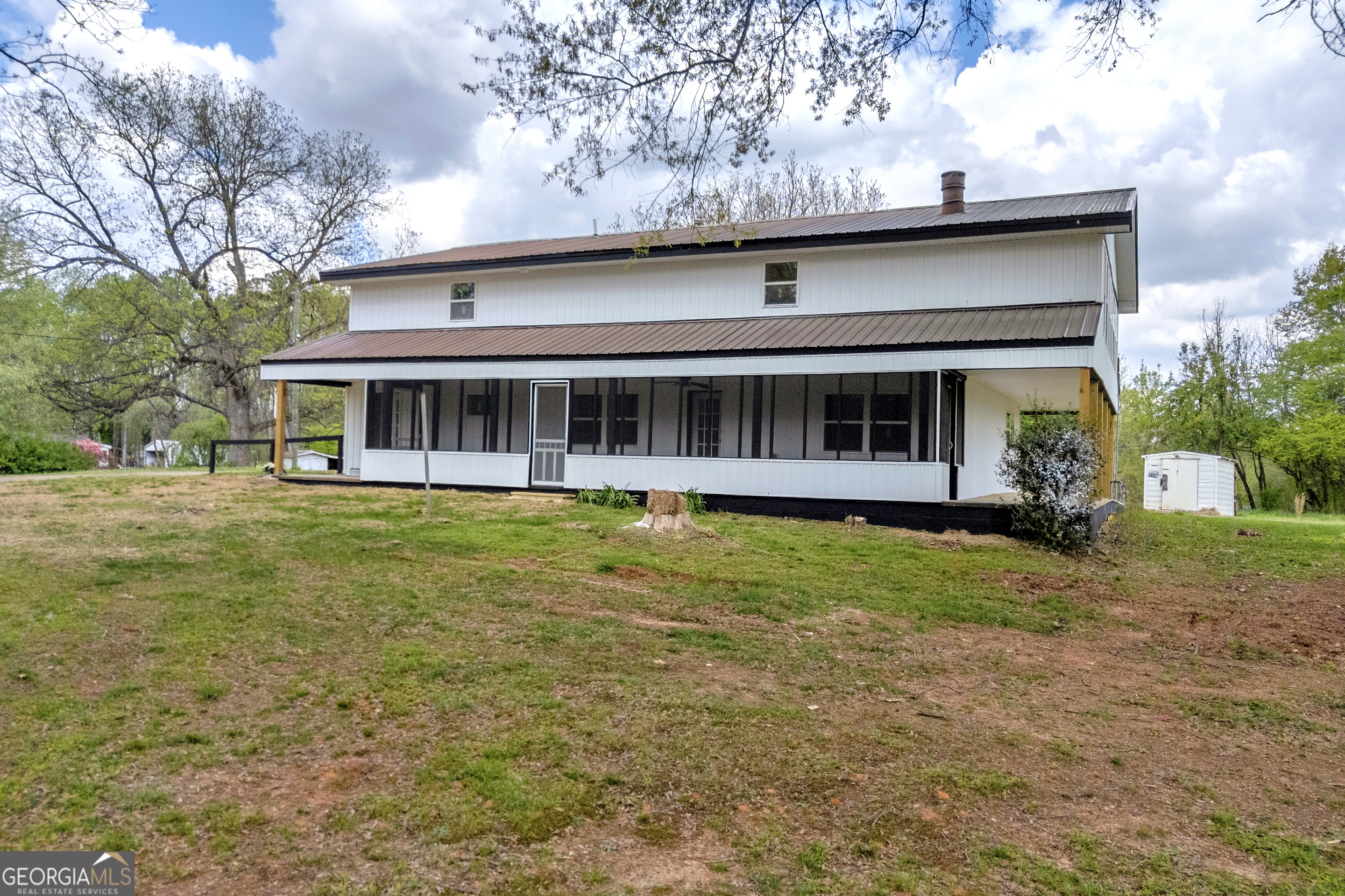 8606 Holly Springs Road Maysville, GA 30558 - Photo 14 of 74 a view of a house with a yard balcony and swimming pool