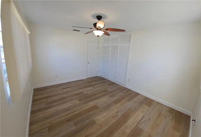 a view of an empty room with windows