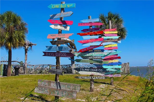 a view of swimming pool with a table and chairs