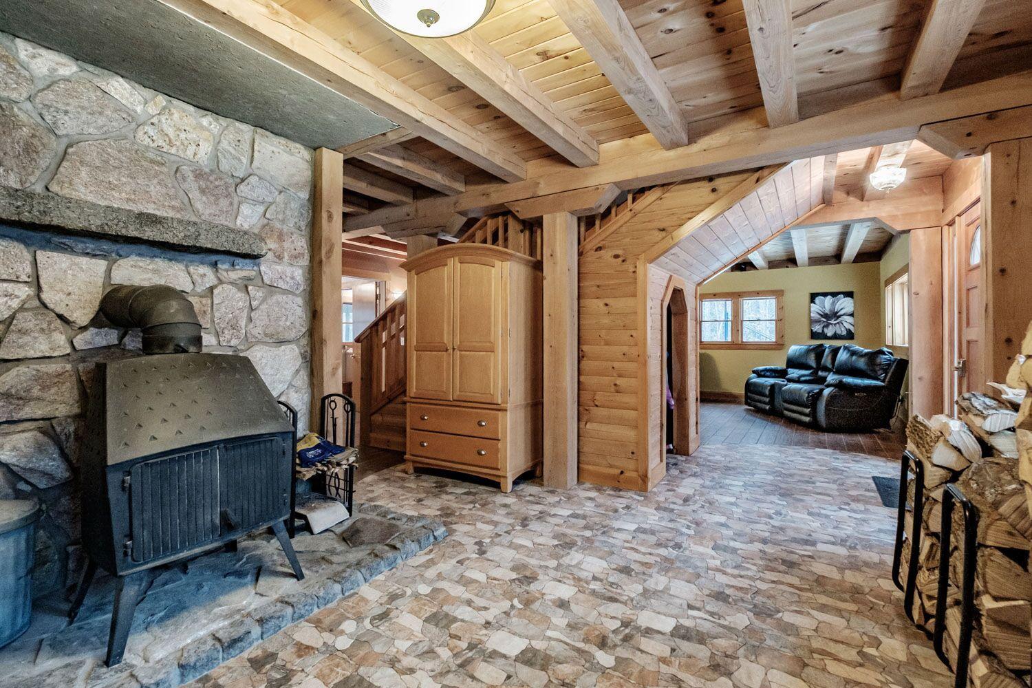 374 Songo School Road Naples, ME 04055 - Photo 5 of 25 wood stove in entrance level