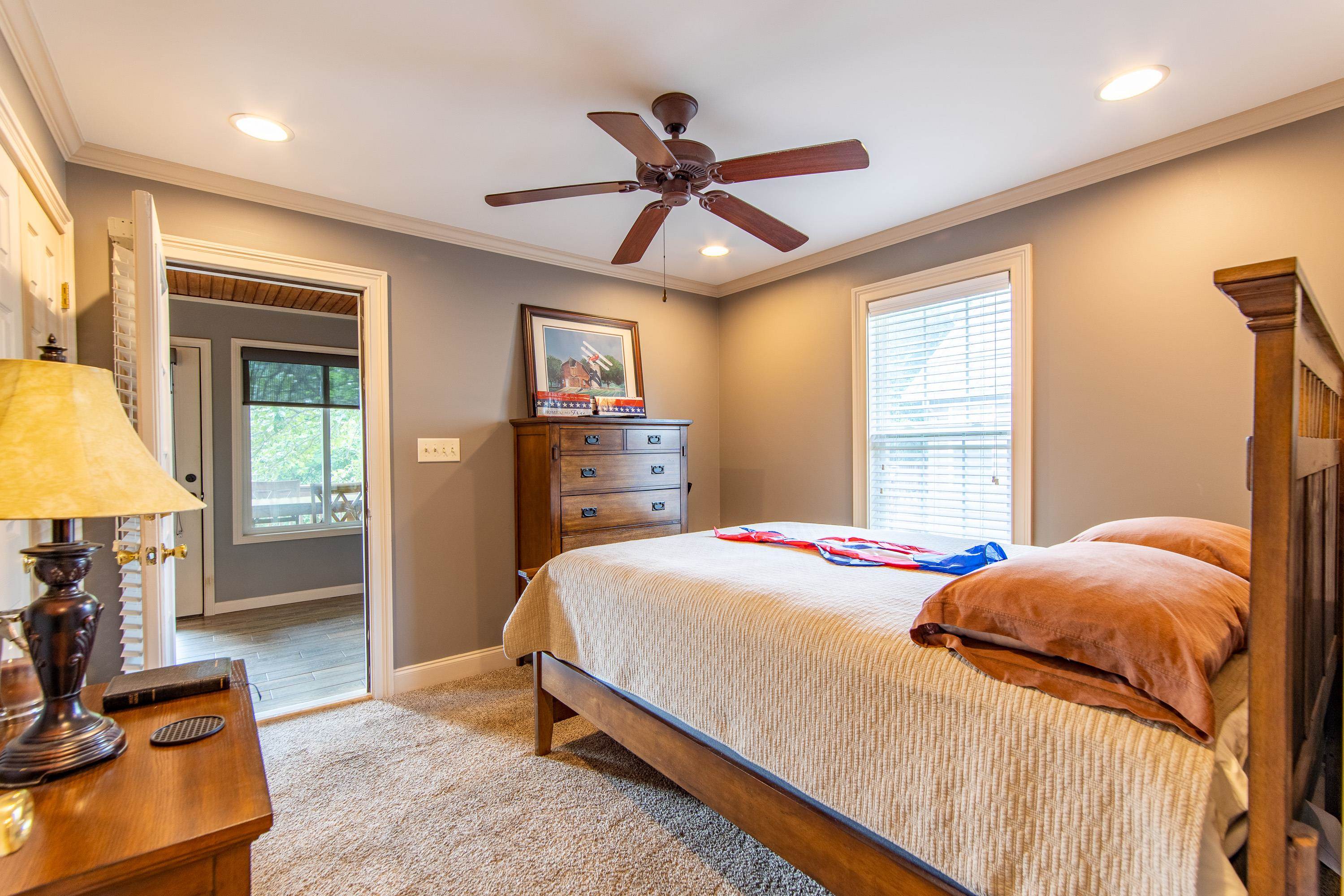 14 Cumberland Circle Iuka, MS 38852 - Photo 14 of 25 a bedroom with a bed and a chandelier