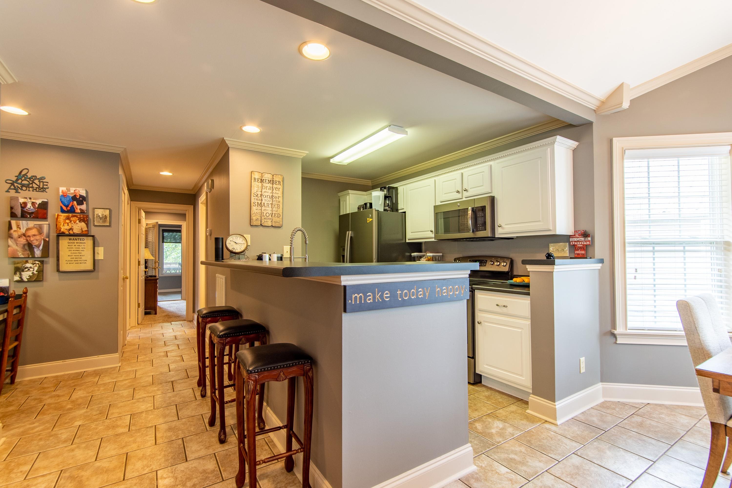 14 Cumberland Circle Iuka, MS 38852 - Photo 7 of 25 a kitchen with stainless steel appliances granite countertop a refrigerator and a stove top oven