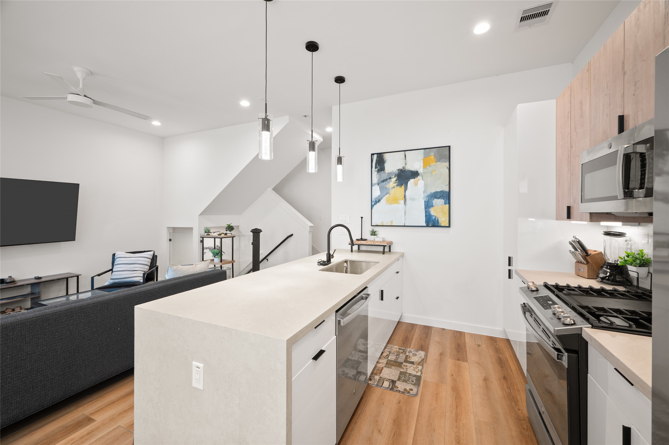 6742 Peerless Street, Unit B Houston, TX 77021 - Photo 14 of 30 a kitchen with a sink a stove and a refrigerator