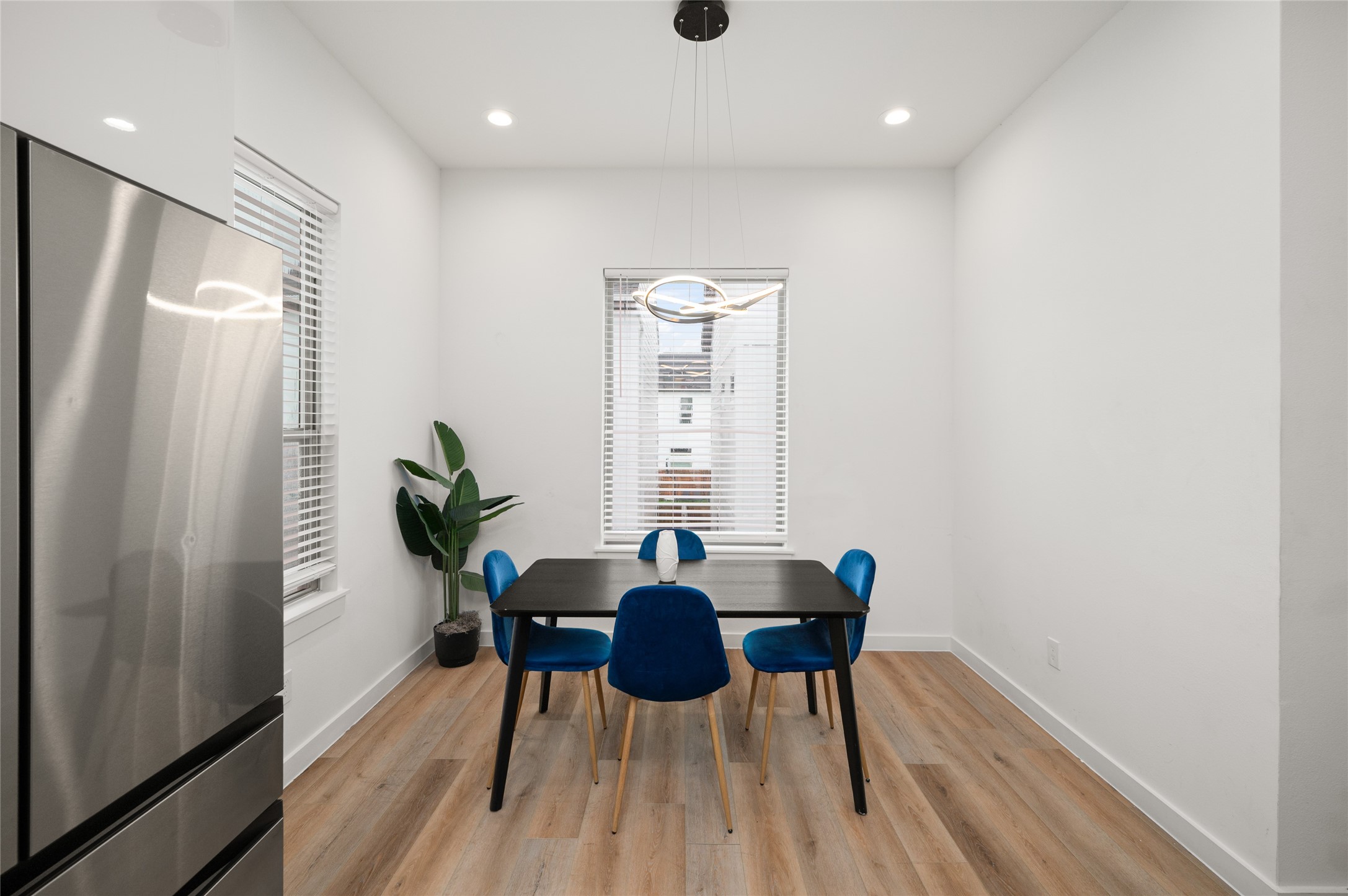 6742 Peerless Street, Unit B Houston, TX 77021 - Photo 16 of 30 a view of a dining room with furniture and wooden floor