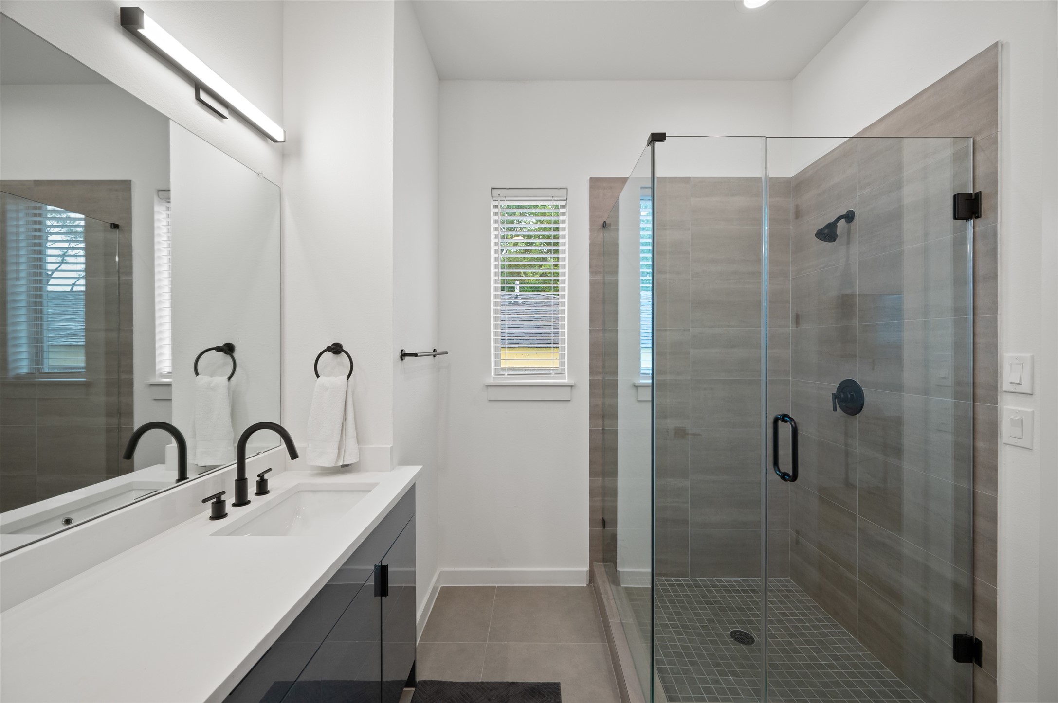 6742 Peerless Street, Unit B Houston, TX 77021 - Photo 24 of 30 a bathroom with a sink and a shower