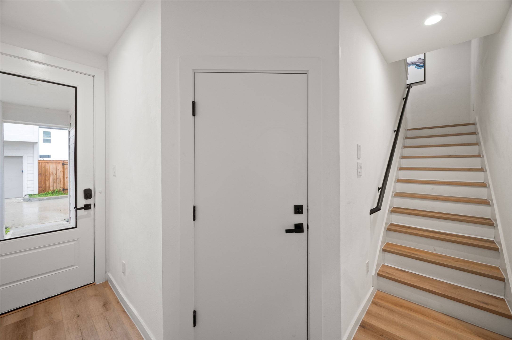 6742 Peerless Street, Unit B Houston, TX 77021 - Photo 5 of 30 a view of a hallway with wooden floor and entryway