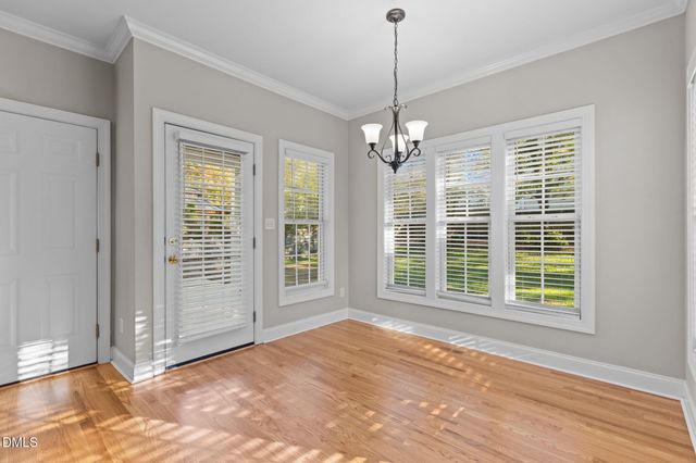 a view of a kitchen with a sink and windows