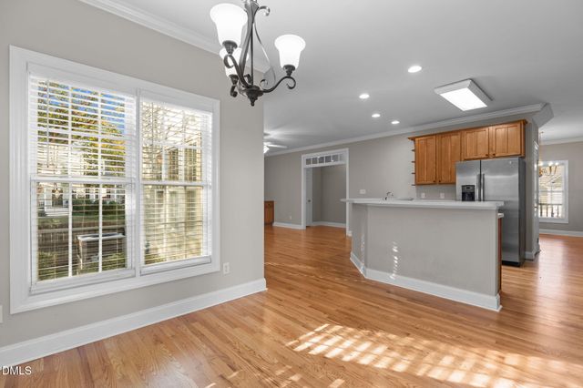 a kitchen with sink stove and cabinets