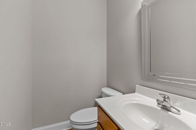 a view of a hallway with the wooden floor and entryway