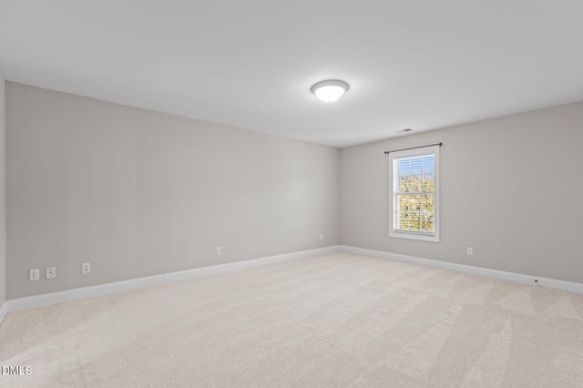 a bathroom with a double vanity sink toilet and a mirror