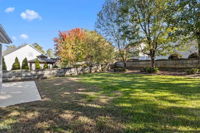 aerial view of a house with a yard and garden