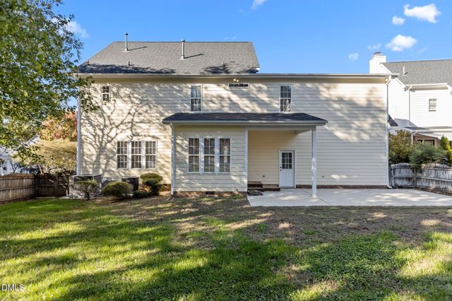 an aerial view of house with yard