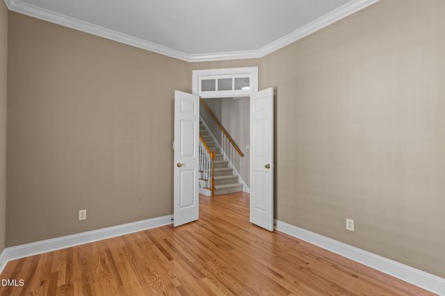 a living room with furniture a fireplace and a large window