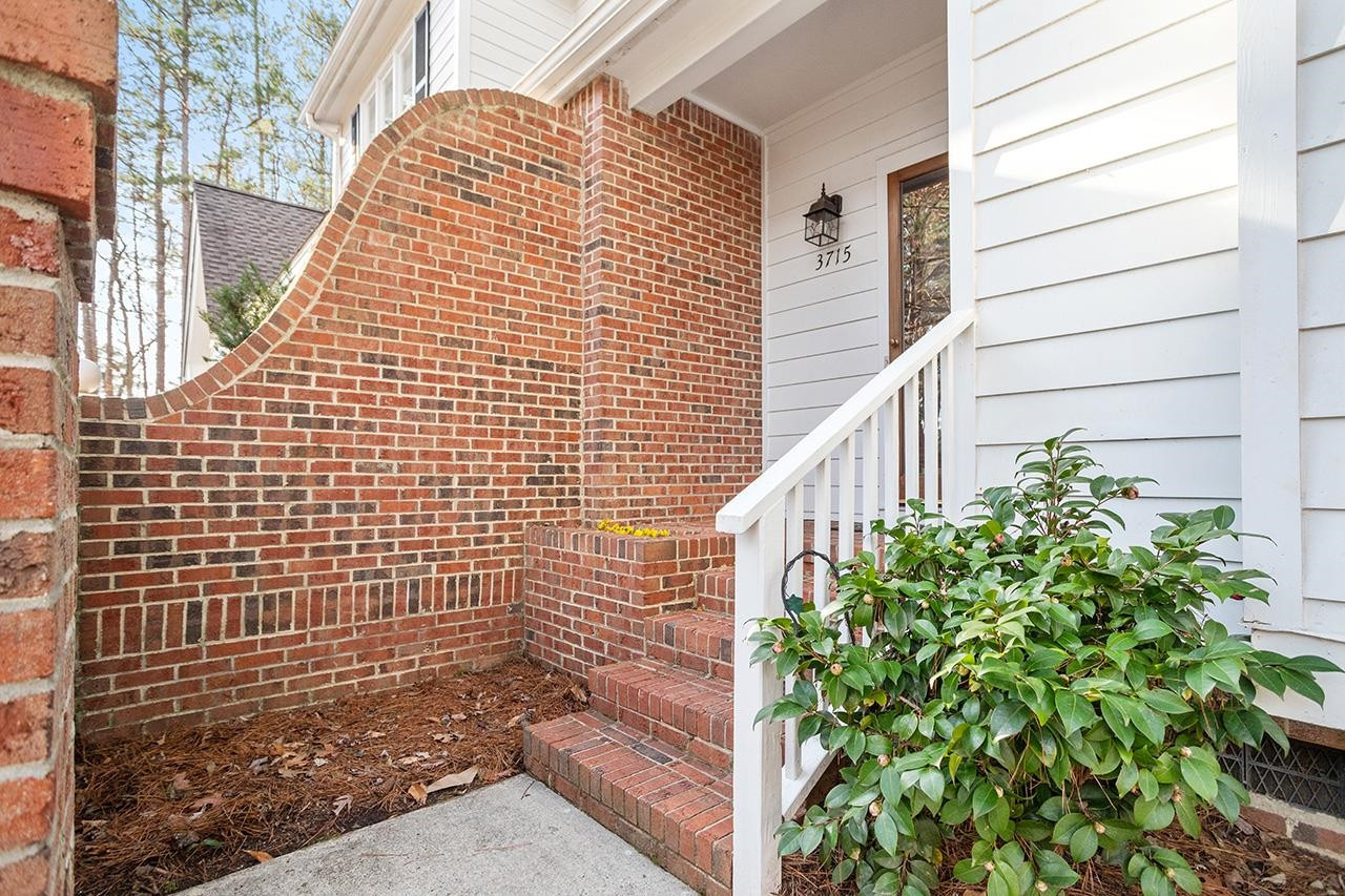 3715 Carnegie Lane Raleigh, NC 27612 - Photo 4 of 37 Brick Entry with Brick Planter