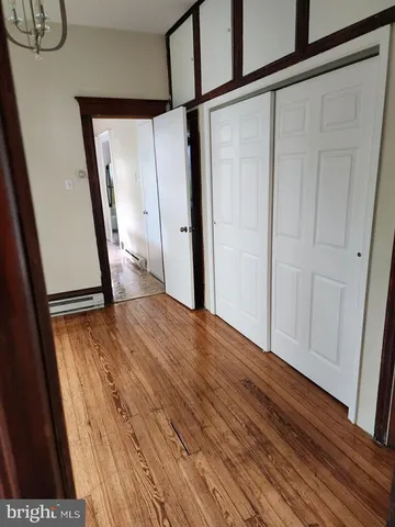 a view of front door with wooden floor