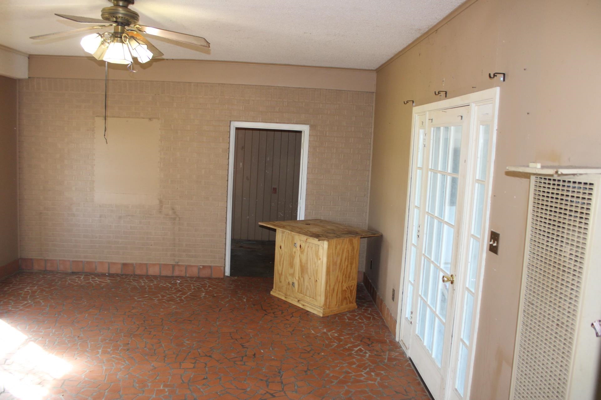1027 Lynn School Road Ripley, TN 38063 - Photo 20 of 26 an empty room with windows and fan