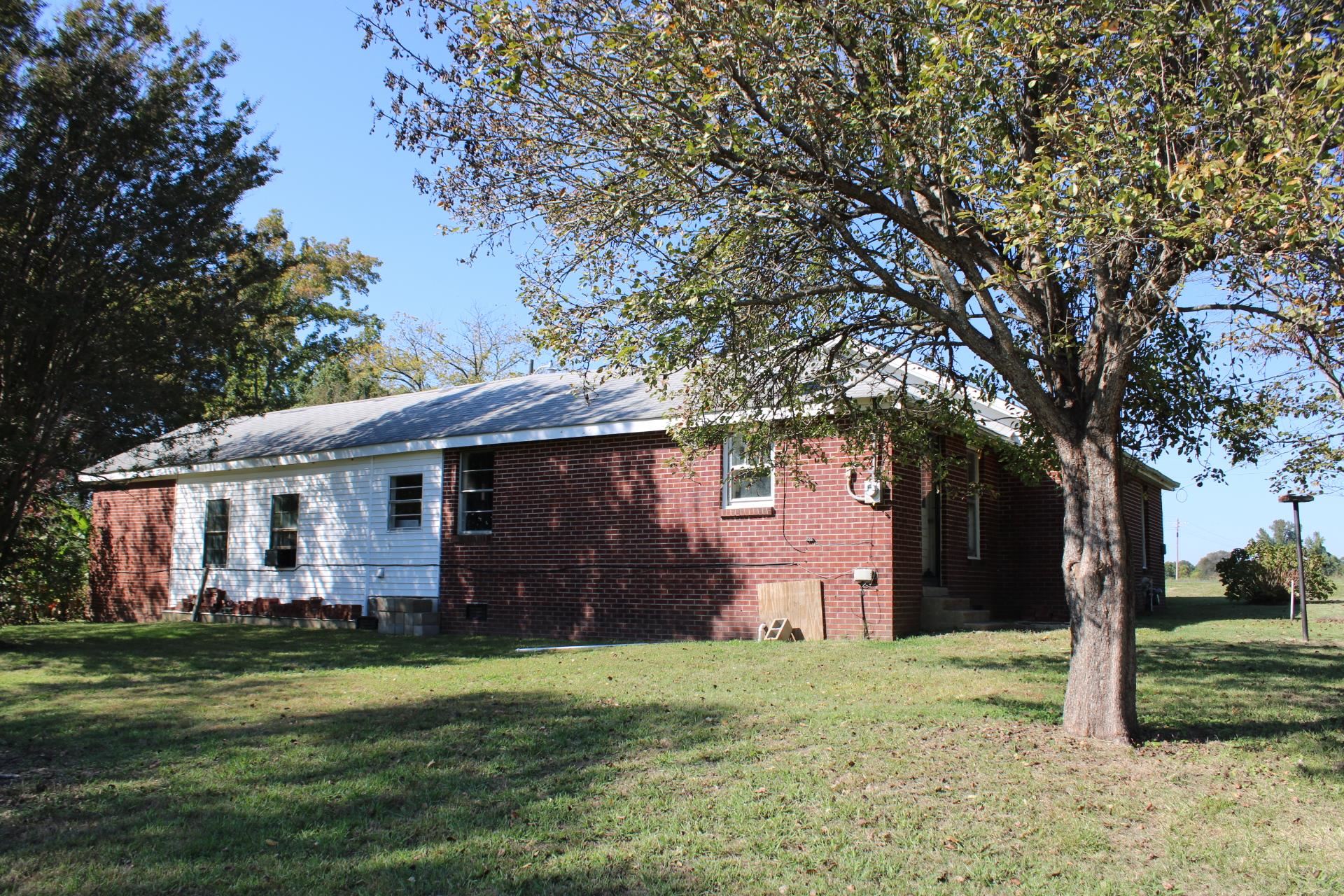 1027 Lynn School Road Ripley, TN 38063 - Photo 25 of 26 a front view of house with yard and trees