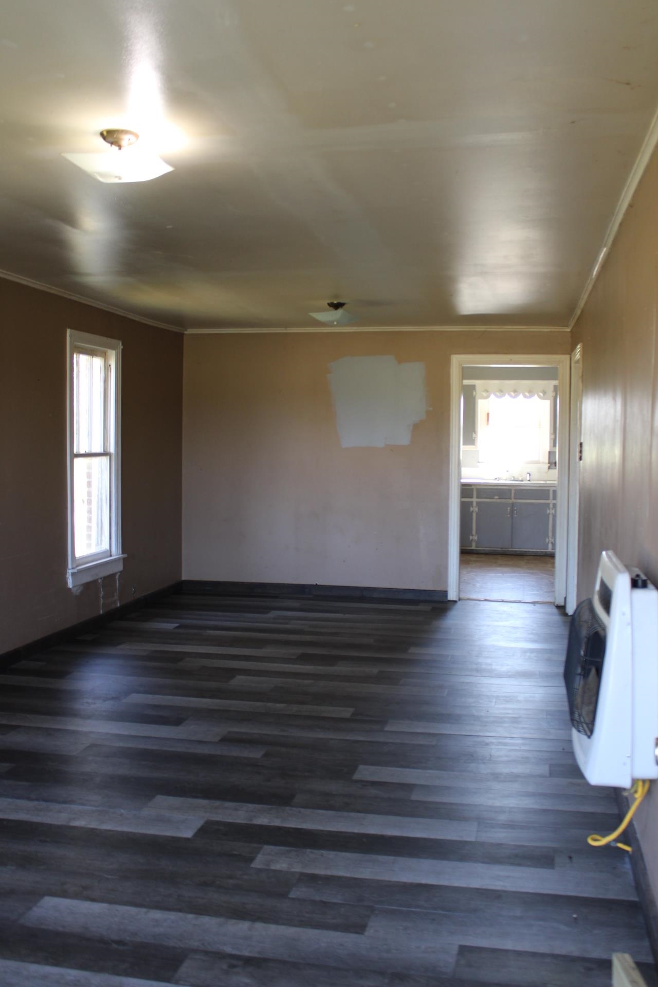 1027 Lynn School Road Ripley, TN 38063 - Photo 8 of 26 a view of hallway with stairs and wooden floor