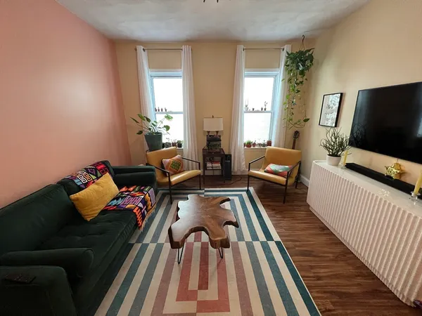 a living room with furniture and a flat screen tv