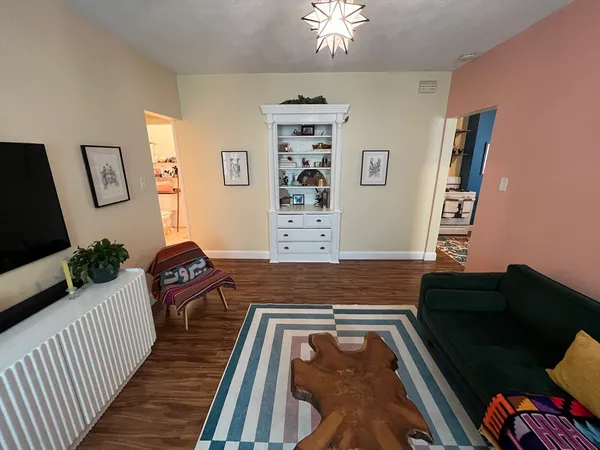 a bed room with a bed and a chair