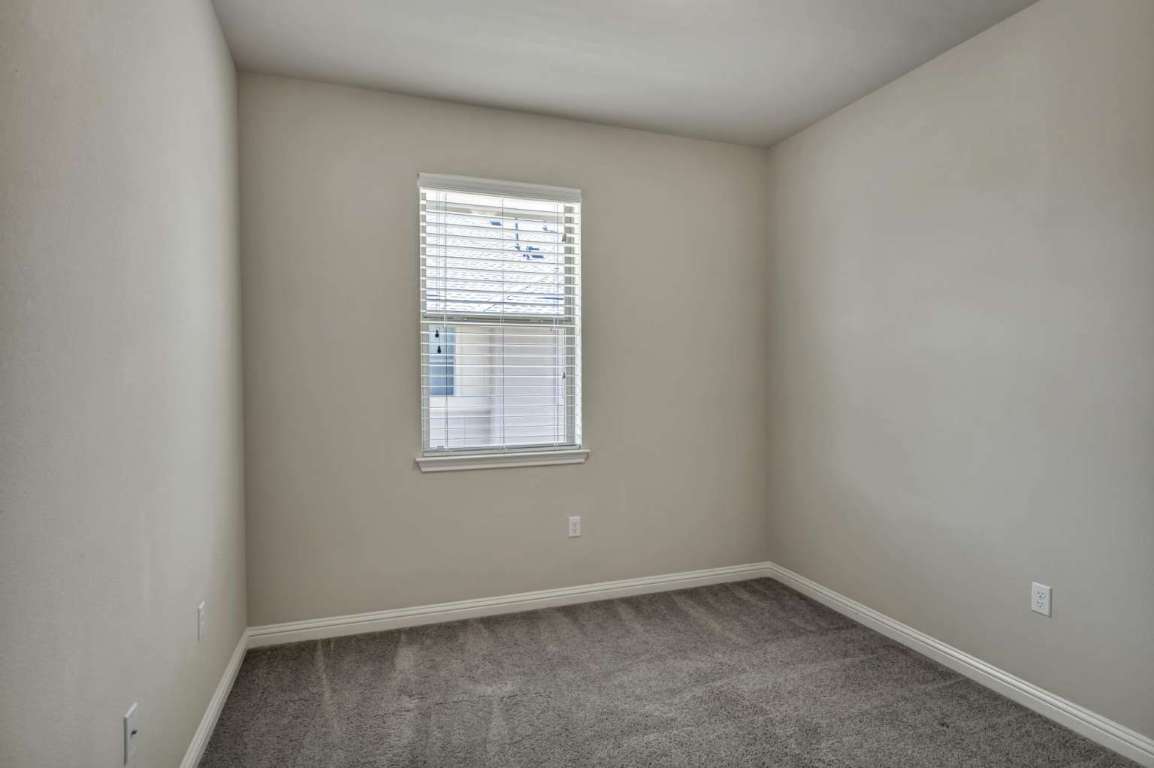 13800 Lyndhurst Street, Unit 223 Austin, TX 78717 - Photo 21 of 40 an empty room with a window