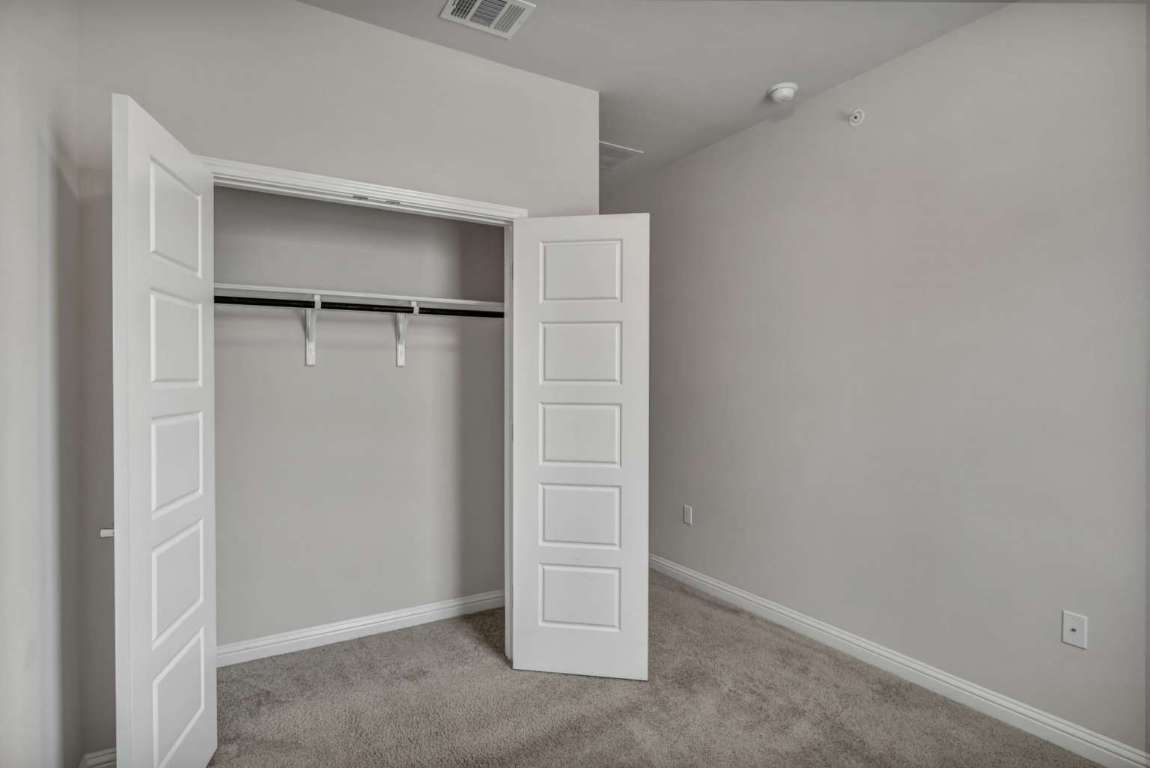 13800 Lyndhurst Street, Unit 223 Austin, TX 78717 - Photo 22 of 40 an empty room with closet