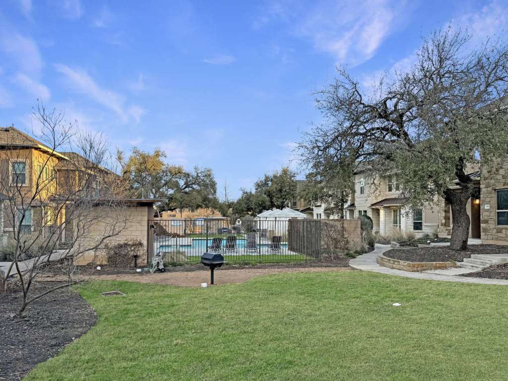 13800 Lyndhurst Street, Unit 223 Austin, TX 78717 - Photo 35 of 40 a house view with swimming pool in front of it