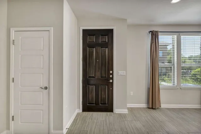 a large kitchen with stainless steel appliances granite countertop a stove a sink and a refrigerator