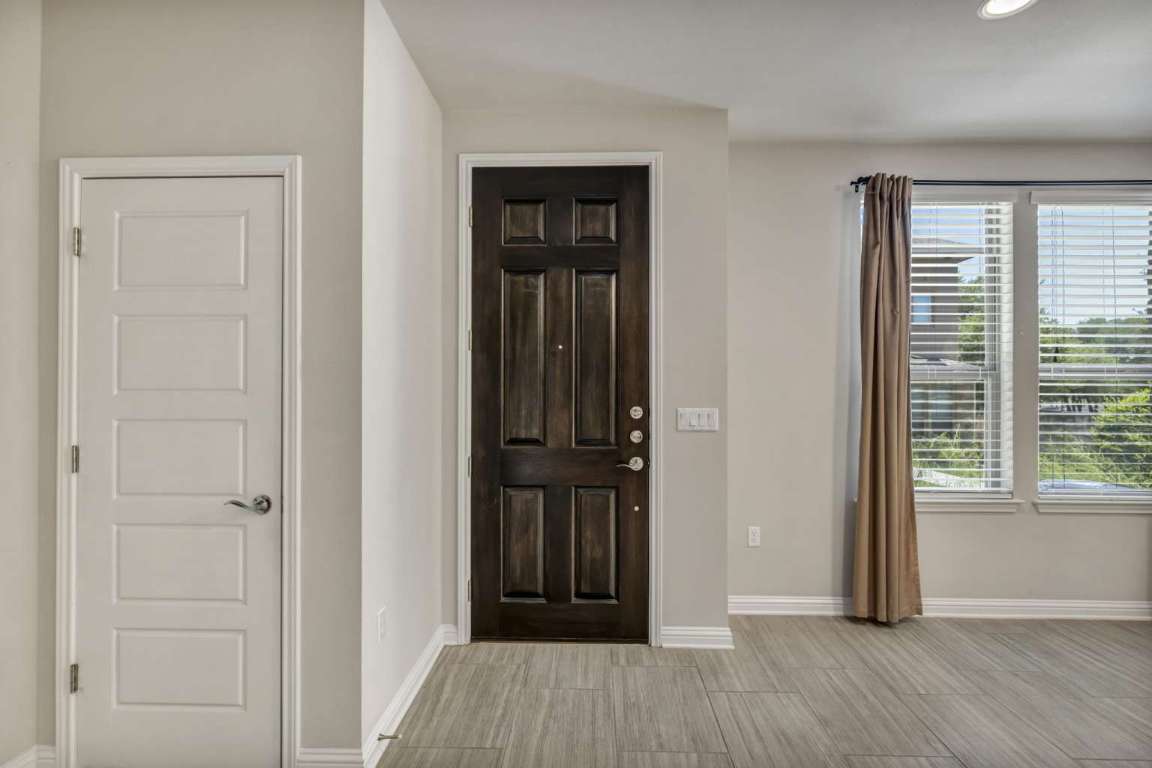 13800 Lyndhurst Street, Unit 223 Austin, TX 78717 - Photo 8 of 40 Foyer entrance with baseboards