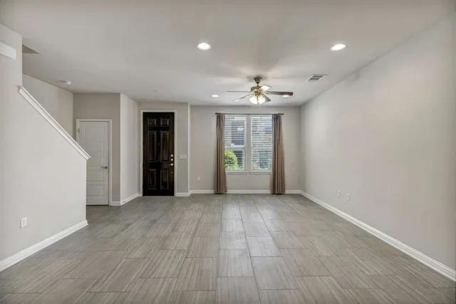 a kitchen with granite countertop stainless steel appliances and wooden cabinets