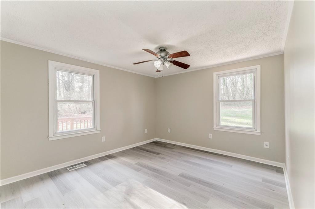 653 Fairview Road Ball Ground, GA 30107 - Photo 35 of 52 a view of an empty room with a window