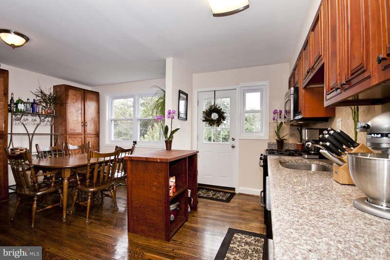 5512 Channing Road Baltimore, MD 21229 - Photo 13 of 29 a kitchen with a sink and a stove top oven
