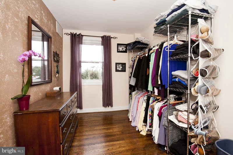 5512 Channing Road Baltimore, MD 21229 - Photo 26 of 29 a view of walk in closet with clothes and shoes