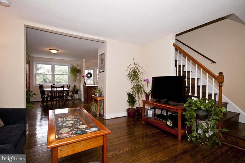 5512 Channing Road Baltimore, MD 21229 - Photo 29 of 29 a living room with furniture and a flat screen tv