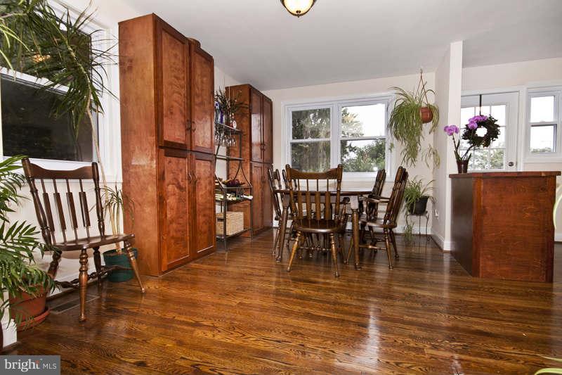 5512 Channing Road Baltimore, MD 21229 - Photo 7 of 29 a view of a dining room with furniture and wooden floor
