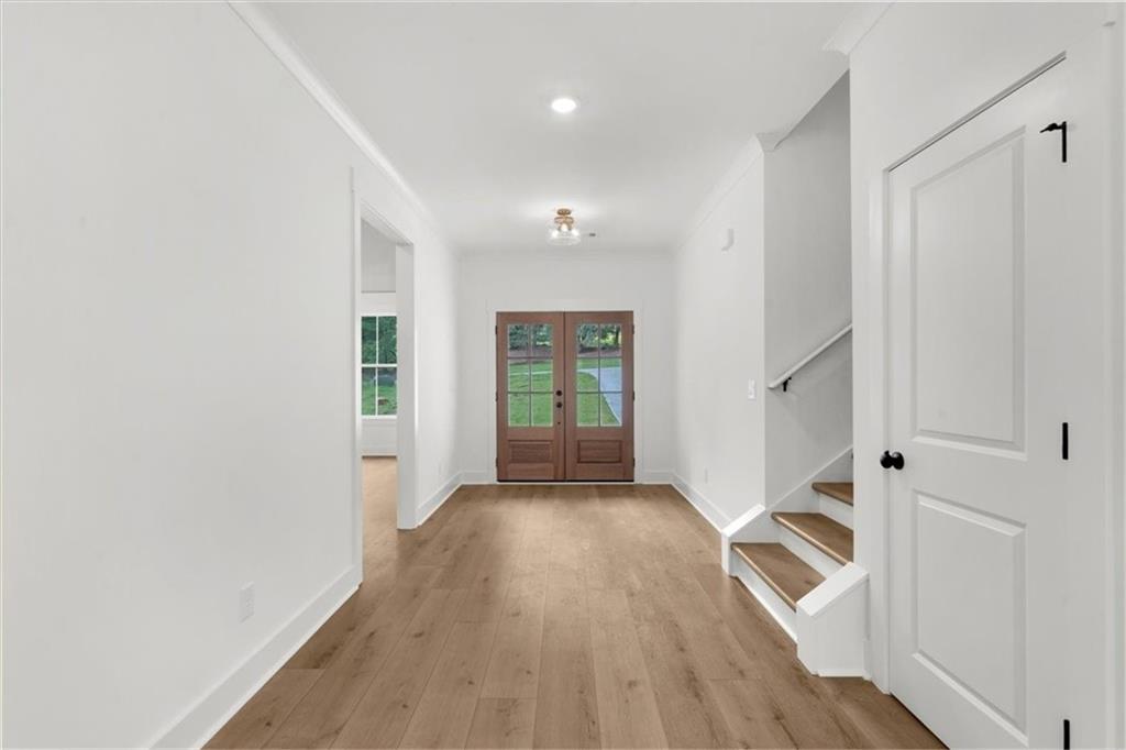 502 Level Creek Road Sugar Hill, GA 30518 - Photo 21 of 54 wooden floor in an empty room with a window
