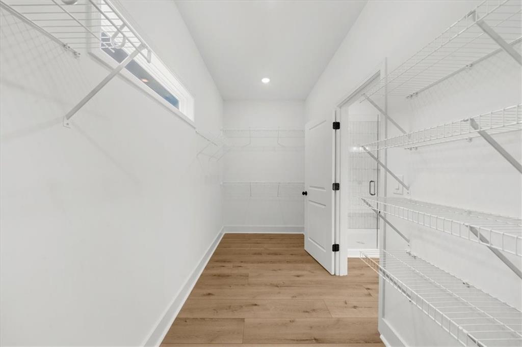 502 Level Creek Road Sugar Hill, GA 30518 - Photo 28 of 54 a view of a hallway with white walls and entryway