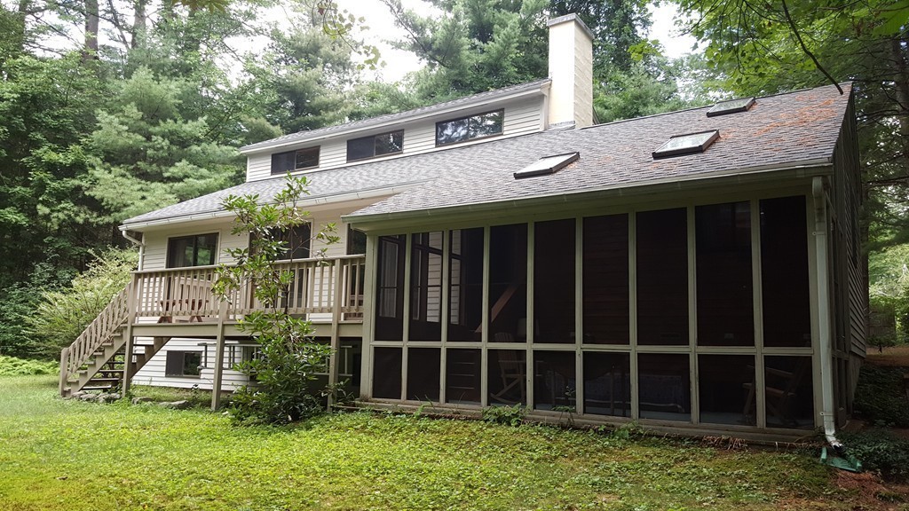 9 Pine Tree Circle Pelham, MA 01002 - Photo 4 of 30 a front view of a house with a garden