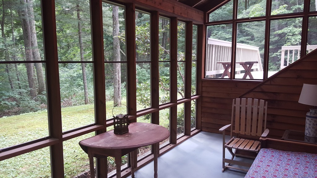 9 Pine Tree Circle Pelham, MA 01002 - Photo 6 of 30 a view of a balcony with furniture and wooden floor