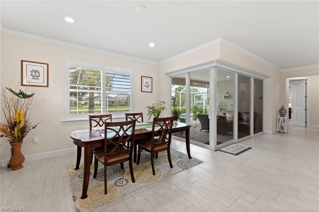 10530 Jackson Square Drive Estero, FL 33928 - Photo 15 of 48 a view of a dining room with furniture and chandelier